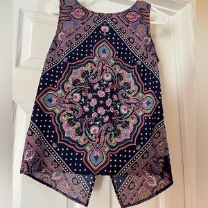 It’s a Reneec blouse, tank top. It’s a colorful pattern, and is a size small